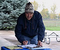 Volunteer signing up for the Cache la Poudre River Cleanup