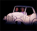 Bullshot Crummond and Rosemary Fenton follow in their car